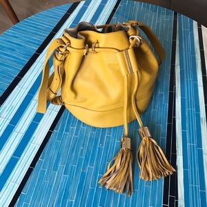 See By Chloe yellow leather bucket bag w/ tassels